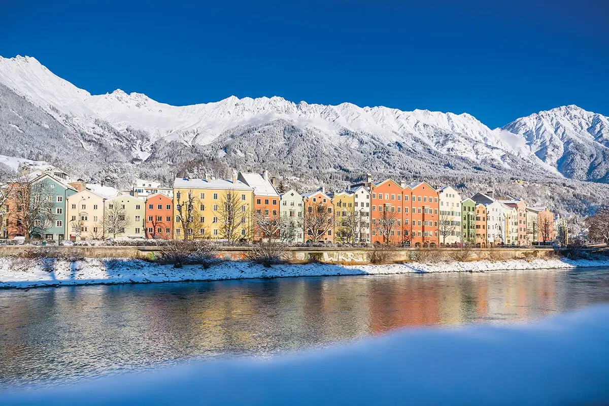 Winter view of colourful Innsbruck houses along the River Inns, featured in the top 16 best places to visit in Austria