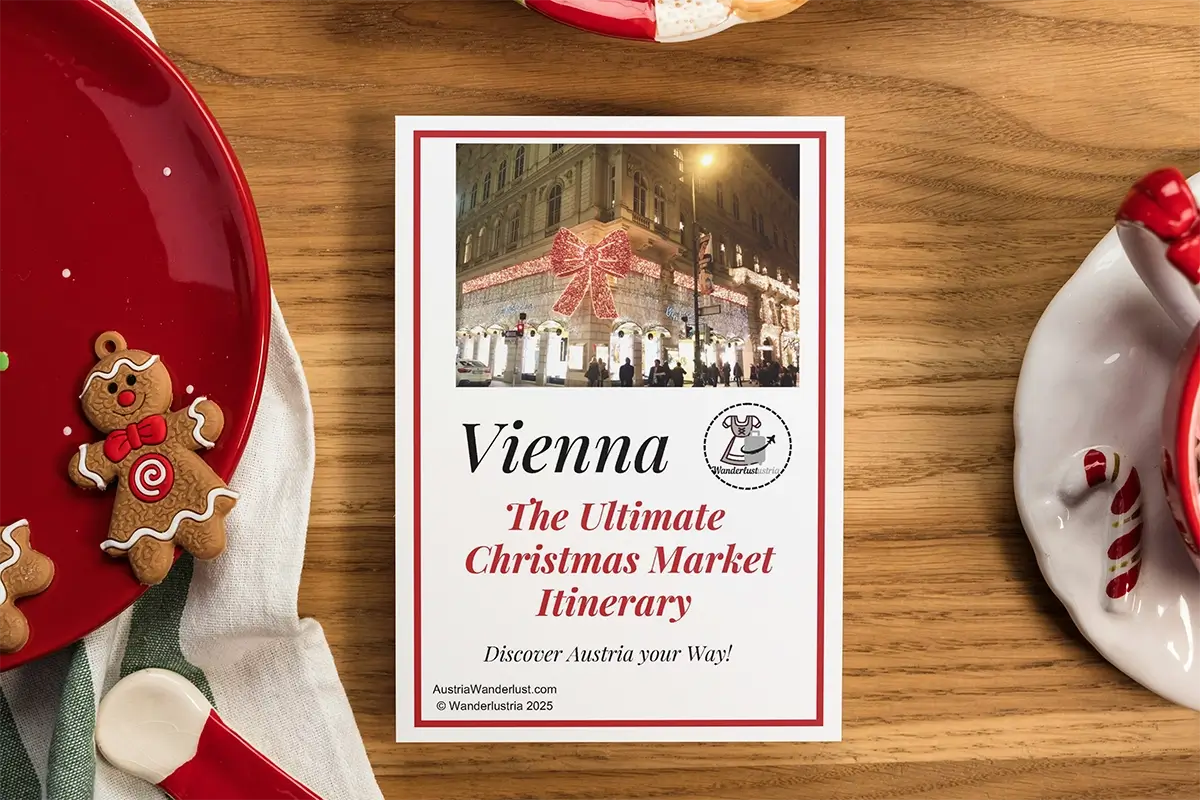 Vienna Christmas Market itinerary PDF mockup on a wooden table with Christmas plates and gingerbread figure